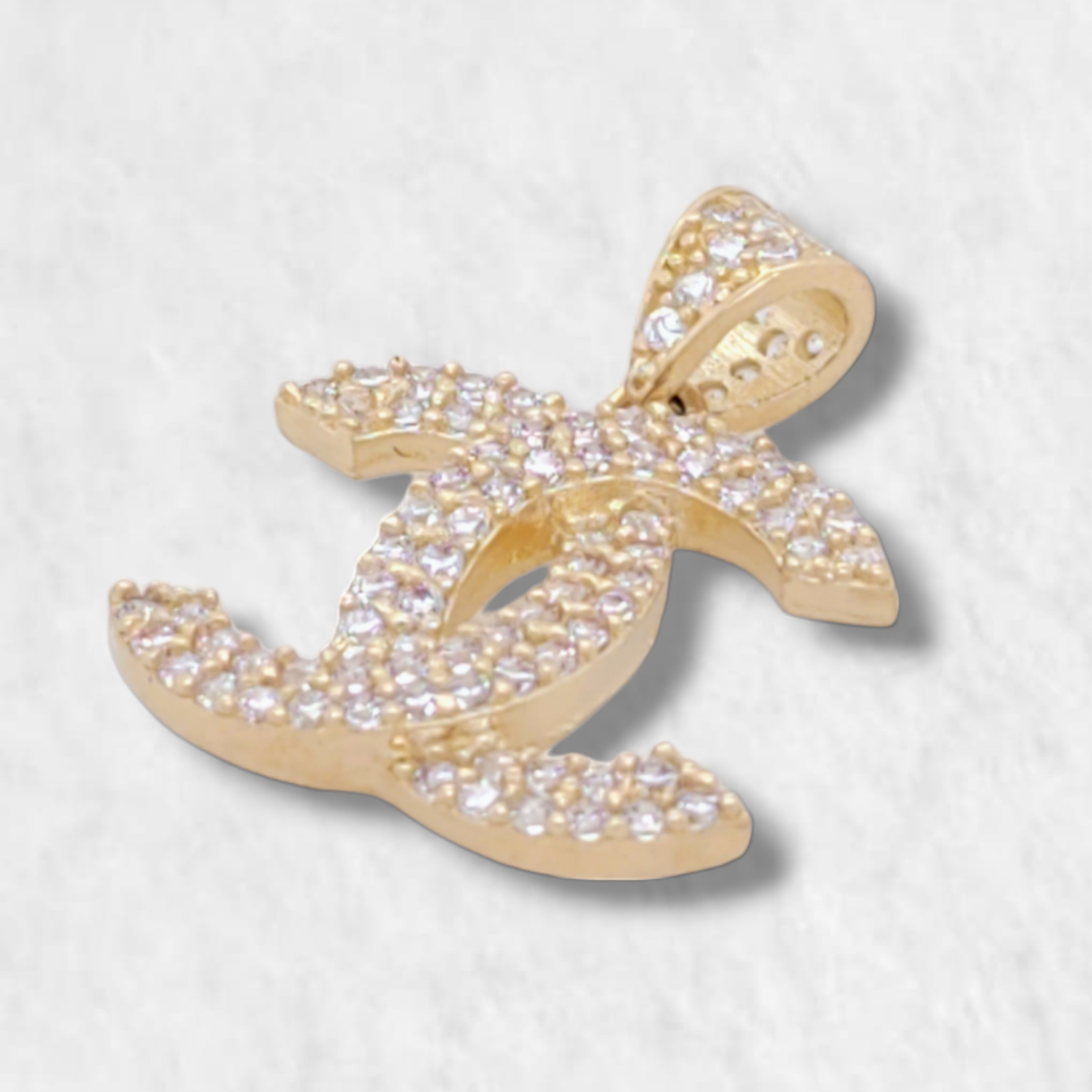 Dije (17 x 14 mm) Dos Aros Cruzados c/ Zircones Pave - Oro Amarillo 14Kts