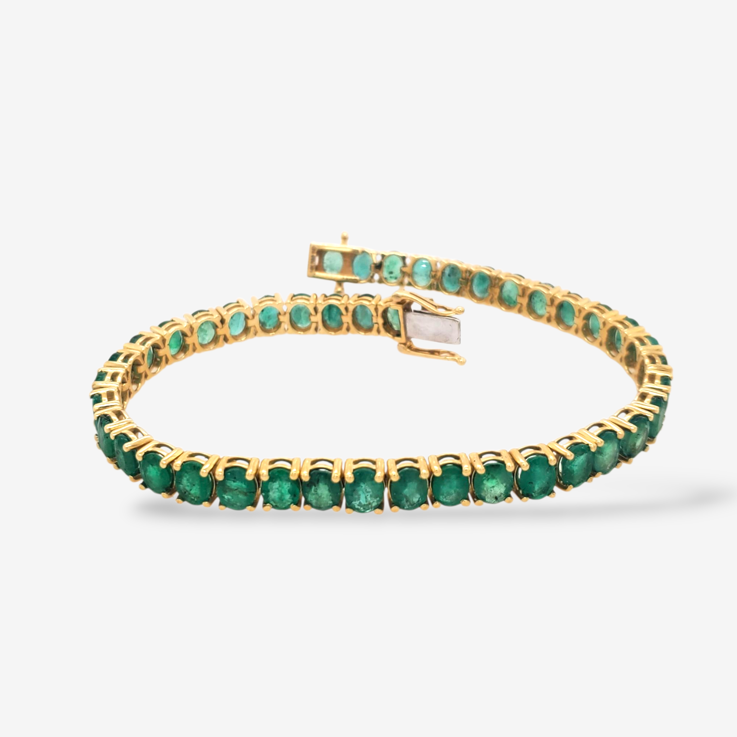 Brazalete (18.5 cm) Tennis c/ Esmeraldas Ovaladas 4 Prongs (12.14 Ct) c/ Cierre Caja - Oro Amarillo 14Kts